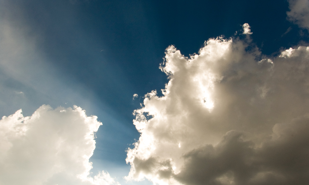 Sun shines from behind clouds