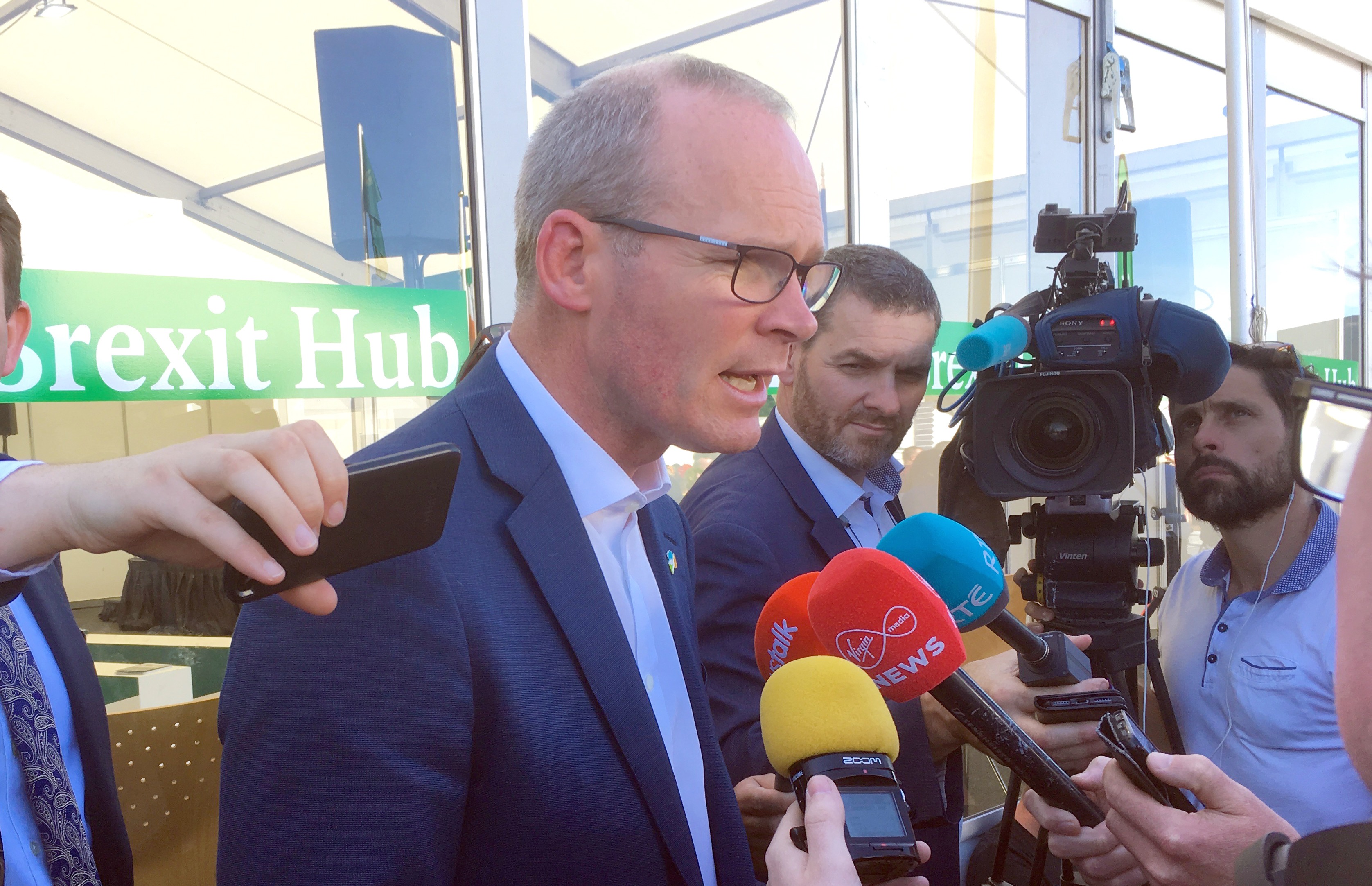 Minister Coveney addresses reporters in Carlow