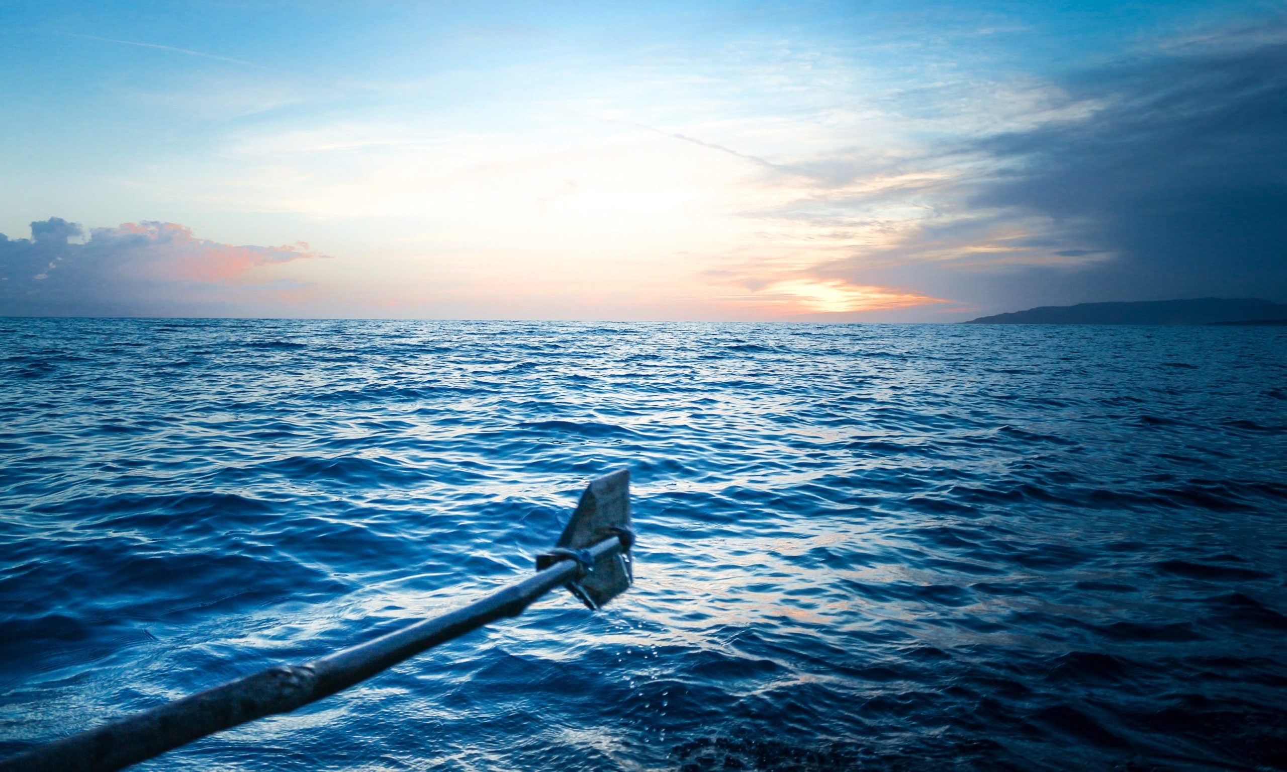 Oar over body of water